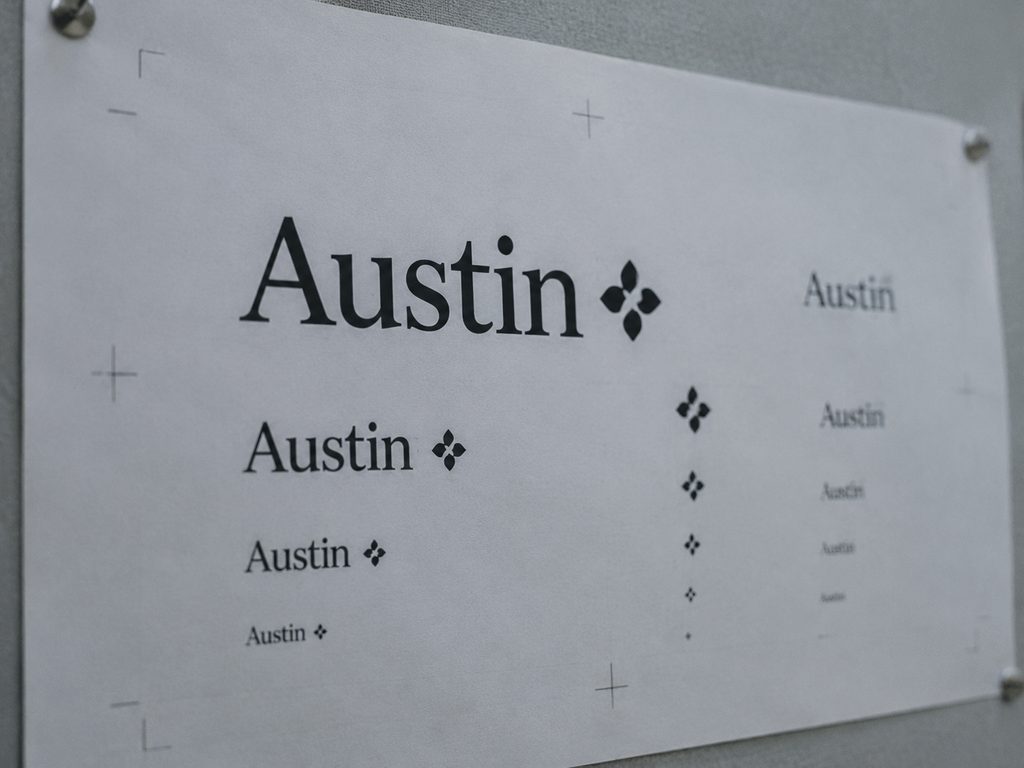 A wordmark proof sheet with the mark printed at several sizes